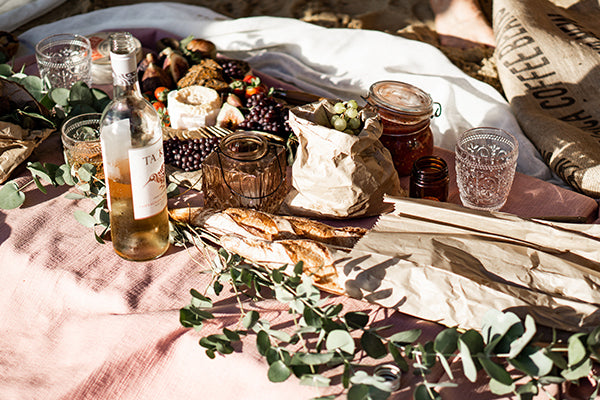 A perfect picnic filled with tasty snacks and delicious wine.